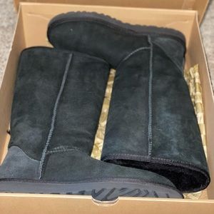 Tall black UGG boots